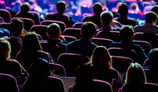 group of people sat in chars at a venue