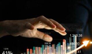 photo of a hand raised over a graphic of stocks and charts