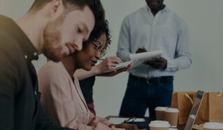 people sat at a desk working