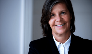 Headshot of a women smiling at the camera