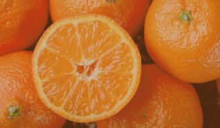 close up of orange, with one cut in half