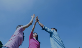 Photo of 3 people high fiving